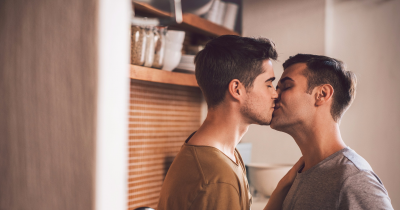 Two men kissing