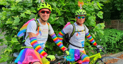 Cyclists in rainbow gear Cyclists in rainbow gear