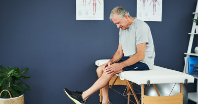 Man with knee raised Man with knee raised