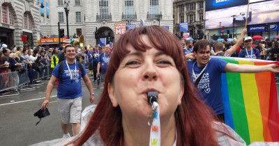 Woman blowing whistle at London Pride Woman blowing whistle at London Pride
