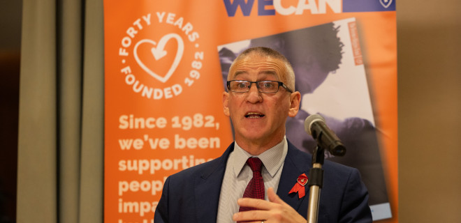 Ian Green at lectern giving speech
