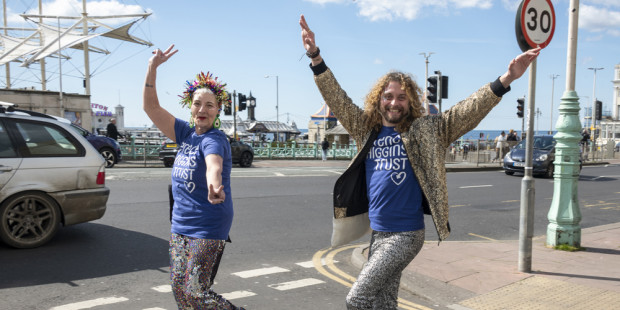 Two people walking in fancy dress and celebrating