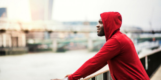 Sporty person looking out across river