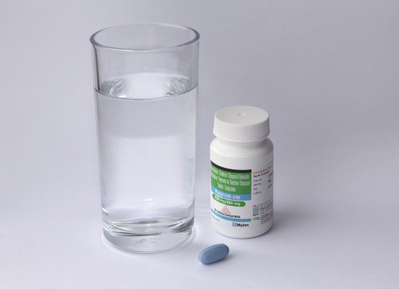 Ricovir PrEP pill and bottle with glass of water